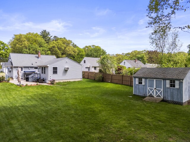 21 Roosevelt Blvd, Enfield, CT 06082 - view of yard with an outdoor structure, a shed, and a patio area