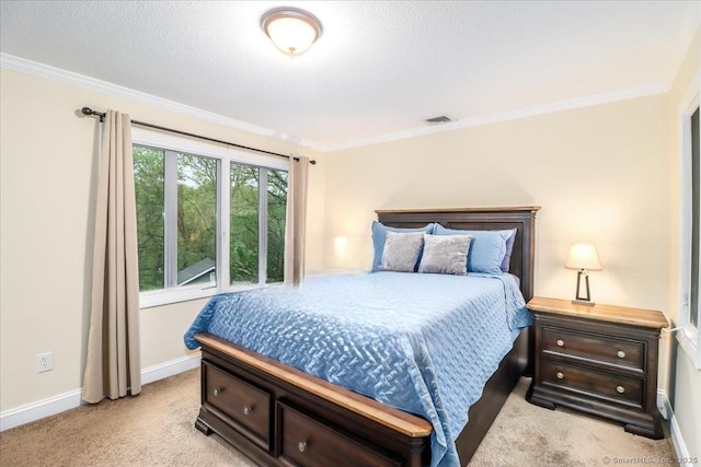 carpeted bedroom featuring crown molding, a textured ceiling, baseboards, and visible vents