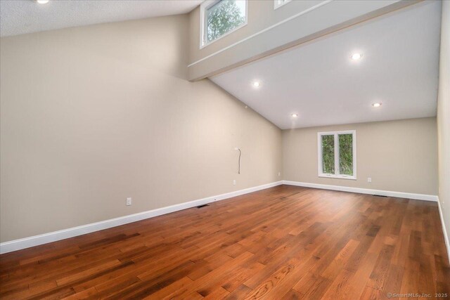 70 Chambers Rd, Danbury, CT 06811 - empty room with dark wood-style flooring, baseboards, high vaulted ceiling, and recessed lighting
