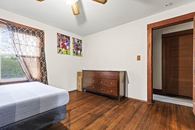 bedroom featuring wood-type flooring, baseboards, and ceiling fan