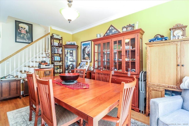 21 Woodcrest Ln Unit 21, Danbury, CT 06810 - dining space featuring ornamental molding, wood finished floors, and stairway