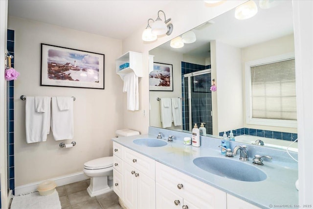 21 Woodcrest Ln Unit 21, Danbury, CT 06810 - bathroom featuring double vanity, tile patterned floors, a shower stall, and a sink