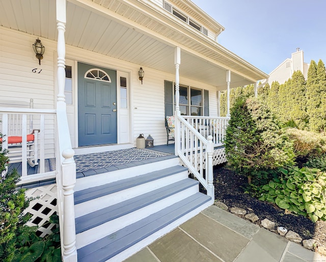 doorway to property featuring a porch