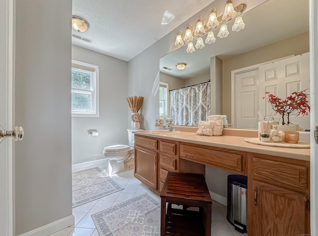 bathroom featuring baseboards, tile patterned flooring, toilet, and visible vents