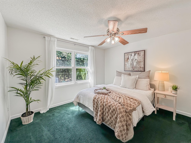 bedroom with carpet flooring, a textured ceiling, visible vents, and baseboards