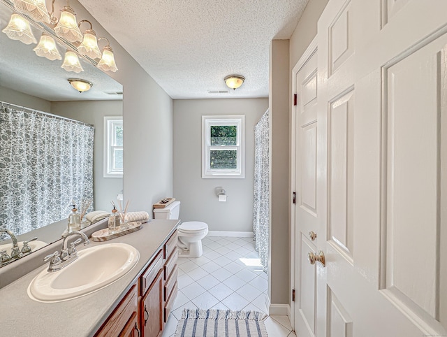 full bath with visible vents, tile patterned flooring, vanity, baseboards, and toilet