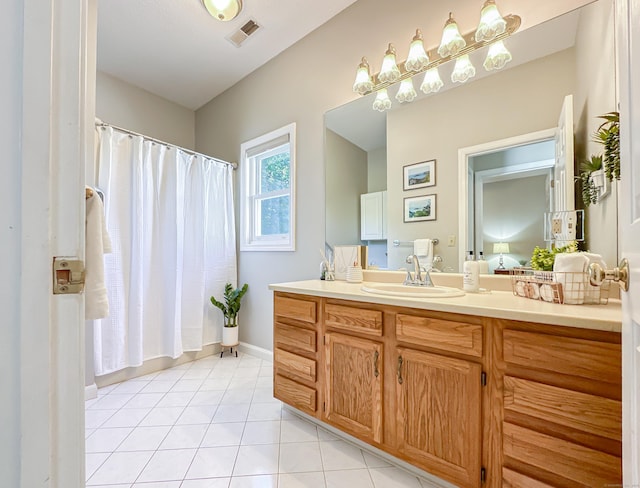 bathroom featuring a shower with curtain, tile patterned floors, visible vents, and vanity