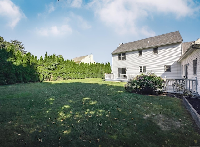 view of yard with a deck