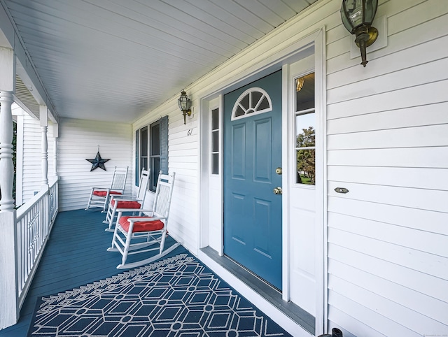 doorway to property featuring covered porch