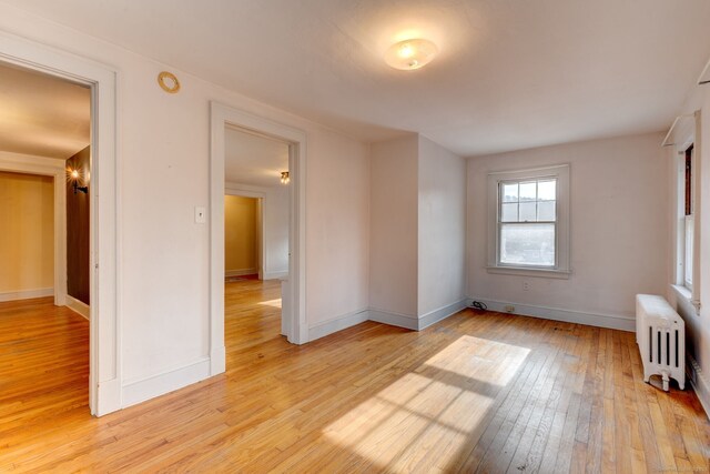 2951 Winsted Rd, Torrington, CT 06790 - unfurnished room featuring radiator, light wood-style flooring, and baseboards