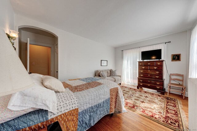 2951 Winsted Rd, Torrington, CT 06790 - bedroom featuring arched walkways and wood finished floors