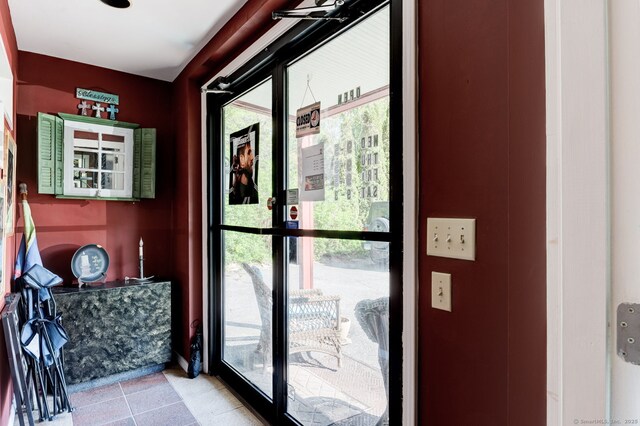 2951 Winsted Rd, Torrington, CT 06790 - doorway with plenty of natural light and light tile patterned floors