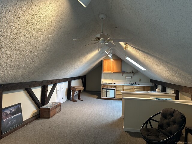 2951 Winsted Rd, Torrington, CT 06790 - additional living space with a ceiling fan, vaulted ceiling, a sink, a textured ceiling, and carpet flooring