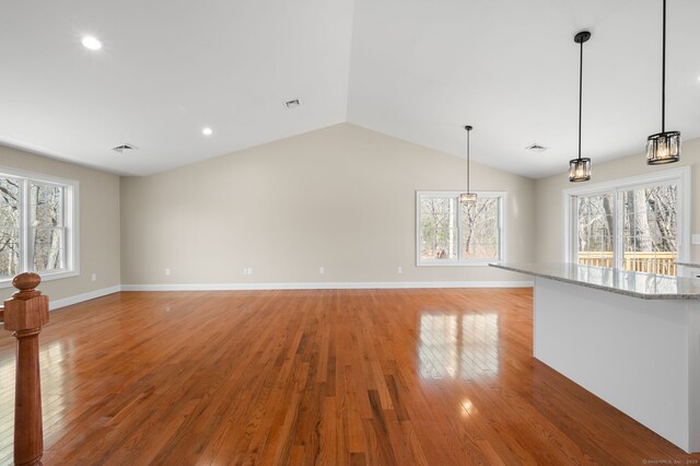 74 N Wawecus Hill Rd, Norwich, CT 06360 - unfurnished room featuring light wood finished floors, plenty of natural light, baseboards, lofted ceiling, and recessed lighting