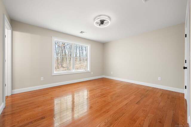 74 N Wawecus Hill Rd, Norwich, CT 06360 - empty room with light wood-style floors and baseboards