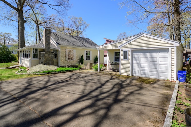 2 Bartholomew Rd, Branford, CT 06405 - ranch-style house featuring a chimney, a garage, and aphalt driveway