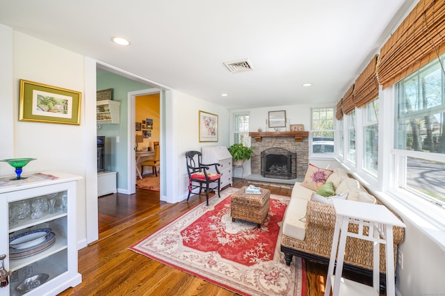 2 Bartholomew Rd, Branford, CT 06405 - living area with visible vents, wood finished floors, a stone fireplace, and recessed lighting