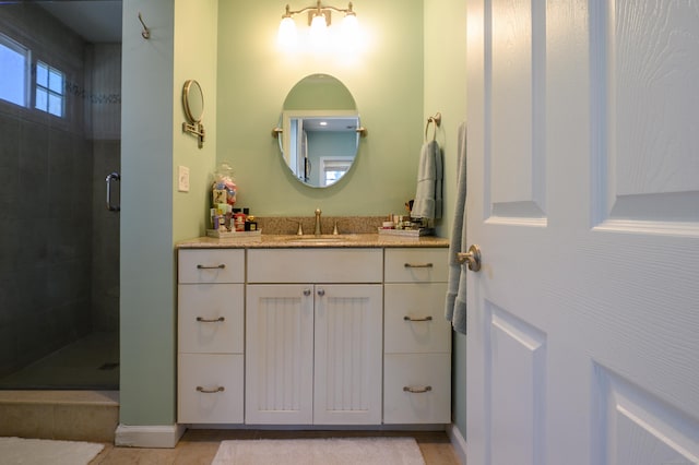 2 Bartholomew Rd, Branford, CT 06405 - full bathroom featuring vanity, tiled shower, and tile patterned floors