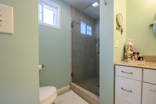 2 Bartholomew Rd, Branford, CT 06405 - bathroom with toilet, vanity, a stall shower, tile patterned flooring, and baseboards