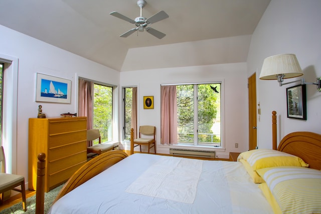 bedroom with vaulted ceiling, a baseboard radiator, and ceiling fan