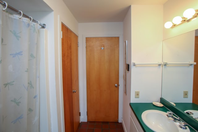 full bath with tile patterned floors, vanity, and a shower with shower curtain