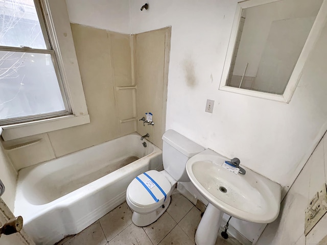bathroom with a sink, tile patterned flooring, toilet, and tub / shower combination
