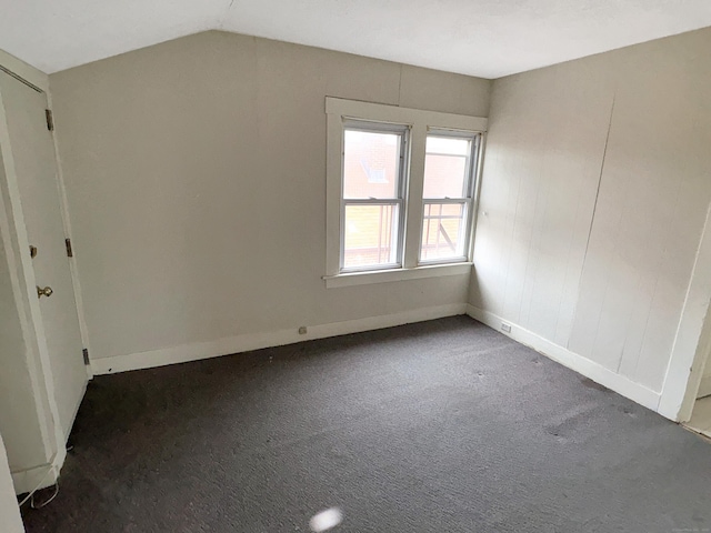 bonus room featuring carpet flooring, baseboards, and lofted ceiling