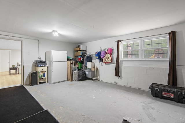 garage featuring freestanding refrigerator
