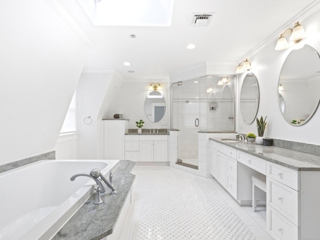 full bath with a stall shower, crown molding, two vanities, and a bath