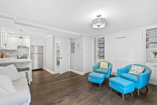 interior space with dark wood-type flooring, baseboards, ornamental molding, and built in features