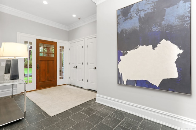 entrance foyer with baseboards, ornamental molding, and recessed lighting
