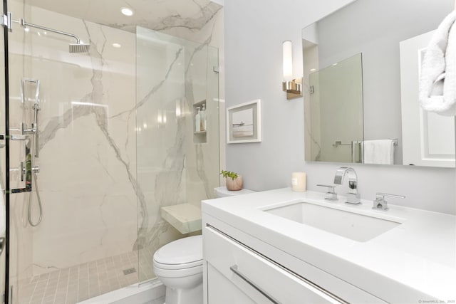 full bath with toilet, vanity, recessed lighting, and a marble finish shower