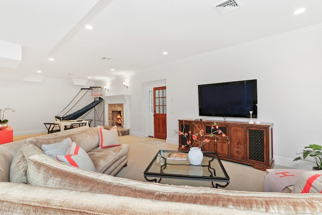 living room featuring carpet flooring, a fireplace, visible vents, baseboards, and recessed lighting