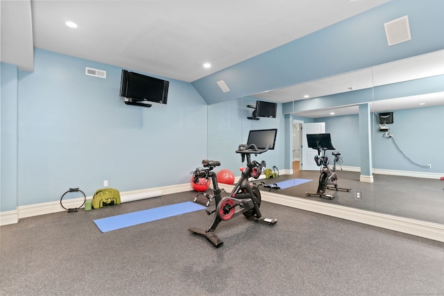 exercise area featuring lofted ceiling, baseboards, visible vents, and recessed lighting