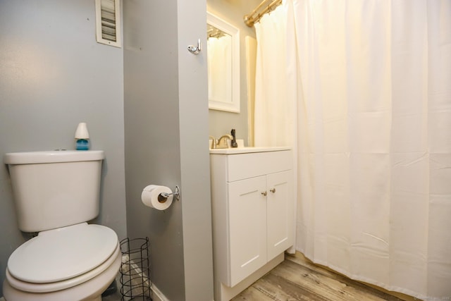 108 New Litchfield St, Torrington, CT 06790 - bathroom with vanity, wood finished floors, and a shower with curtain