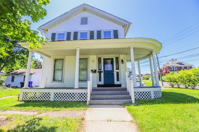 108 New Litchfield St, Torrington, CT 06790 - view of front of house with covered porch and a front lawn