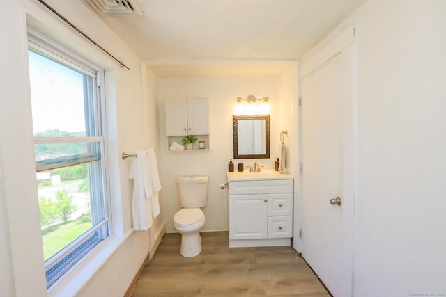 108 New Litchfield St, Torrington, CT 06790 - bathroom featuring vanity, wood finished floors, and healthy amount of natural light
