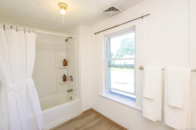 108 New Litchfield St, Torrington, CT 06790 - bathroom with shower / tub combo, wood finished floors, and plenty of natural light