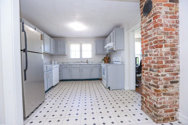 108 New Litchfield St, Torrington, CT 06790 - kitchen with white appliances, light flooring, gray cabinetry, and range hood