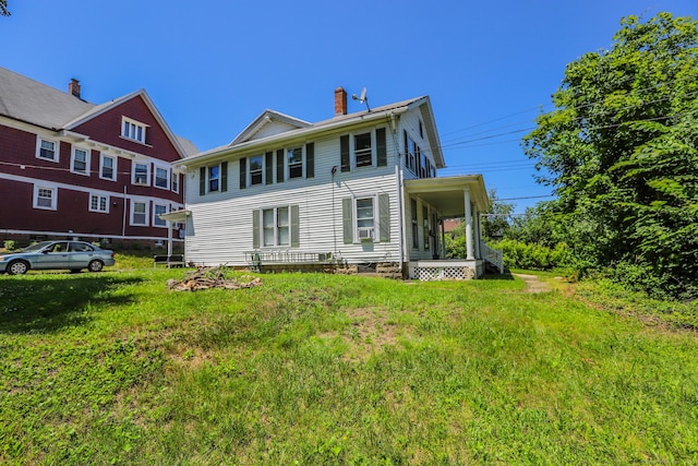 108 New Litchfield St, Torrington, CT 06790 - back of property with a chimney