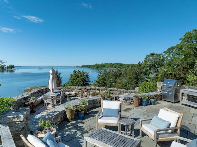 25 Tokeneke Trl, Darien, CT 06820 - view of patio with grilling area, a water view, and outdoor dining area