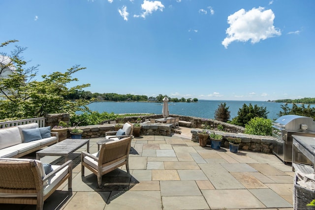 25 Tokeneke Trl, Darien, CT 06820 - view of patio / terrace with a water view and an outdoor hangout area