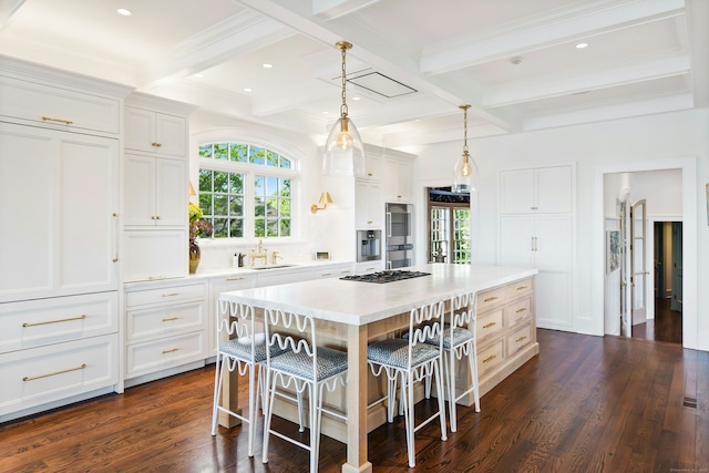 25 Tokeneke Trl, Darien, CT 06820 - kitchen with coffered ceiling, a sink, plenty of natural light, a breakfast bar area, and beamed ceiling