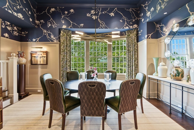 25 Tokeneke Trl, Darien, CT 06820 - dining space featuring wallpapered walls, wainscoting, a decorative wall, ornamental molding, and wood finished floors