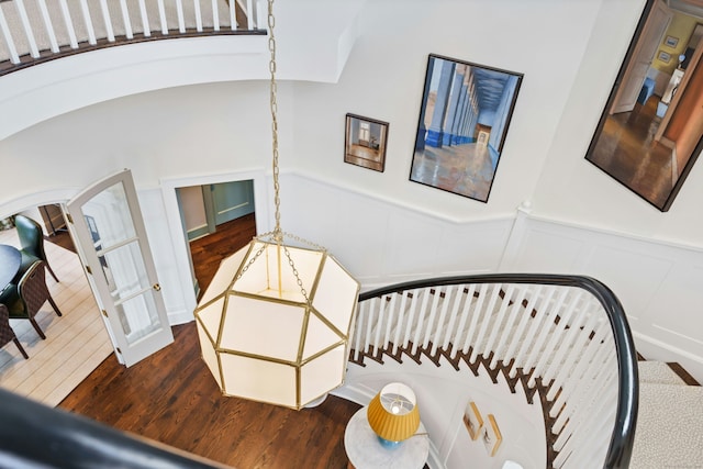 25 Tokeneke Trl, Darien, CT 06820 - stairway with a decorative wall, wood finished floors, and wainscoting