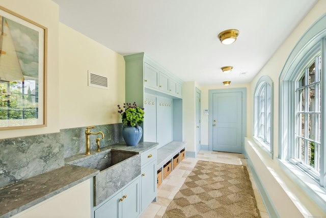 25 Tokeneke Trl, Darien, CT 06820 - mudroom with a sink, light tile patterned floors, and baseboards