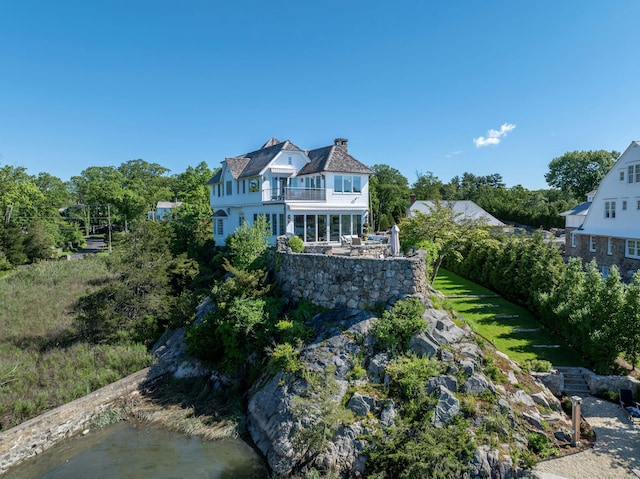 25 Tokeneke Trl, Darien, CT 06820 - back of house with a balcony and a chimney