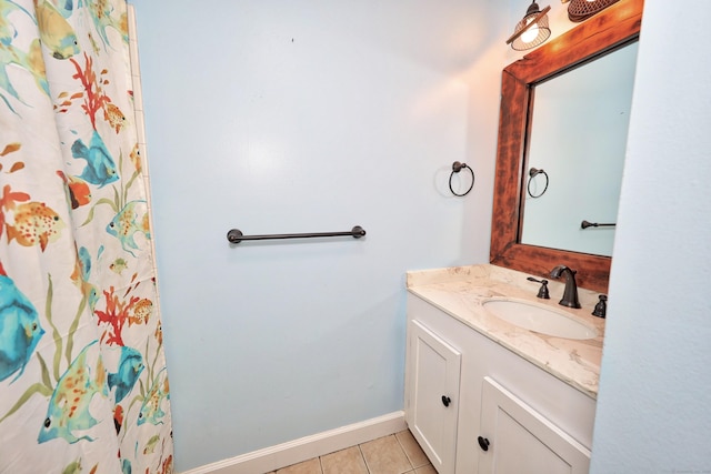 bathroom with vanity, tile patterned flooring, baseboards, and a shower with curtain