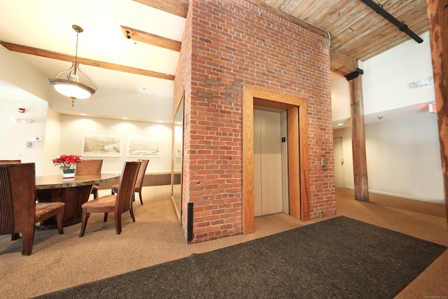 dining space featuring elevator, carpet, baseboards, beamed ceiling, and wood ceiling