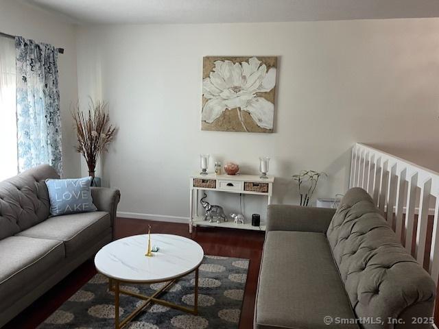 57 Meetinghouse Vlg Unit 6, Meriden, CT 06450 - living room featuring baseboards and wood finished floors